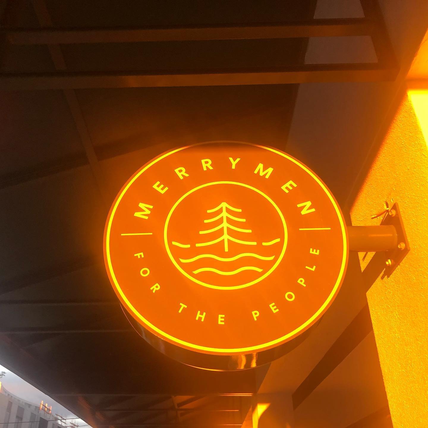 The glowing Merrymen sign that reads for the people